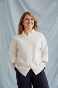 Helen Egger posed in front of a white backdrop.
