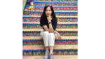 Lijun Li sitting on colorful steps