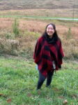 Jihee Lee standing in a field