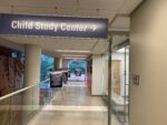 Hallway outside the CSC reception area showing posters on display