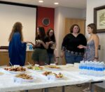 Graduate students socializing at event