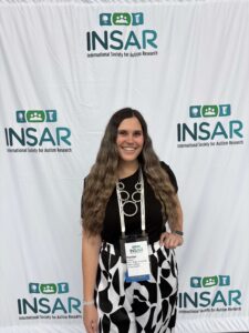 Hunter Mattern standing in front of INSAR backdrop.