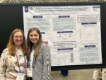 Kristin Buss, Ph.D., and Maddie Politte-Corn standing next to research poster at 2025 SRCD