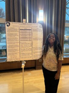 Sherille Bosfield standing next to research poster at 2025 CMSN conference